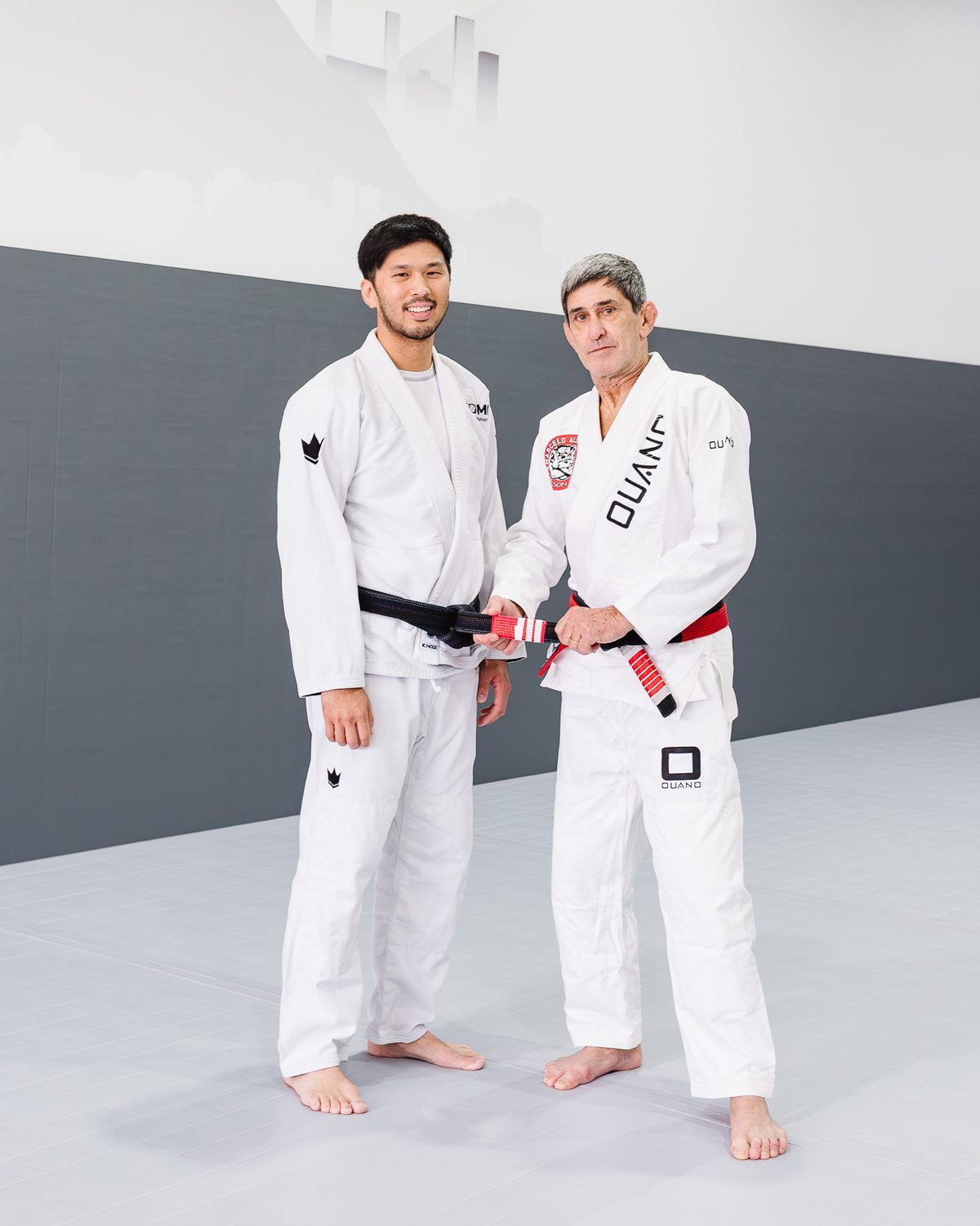 Brian Yi with coral belt Marcelo Alonso at his third-degree black belt promotion