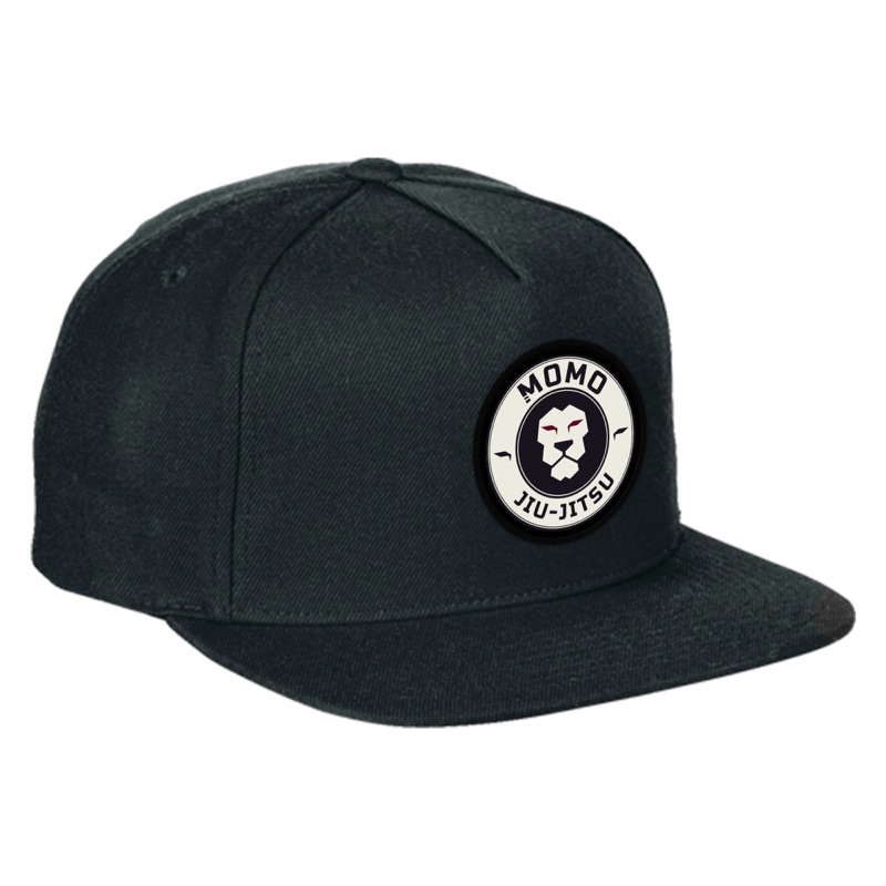 Black MOMO Academy hat with the round lion patch